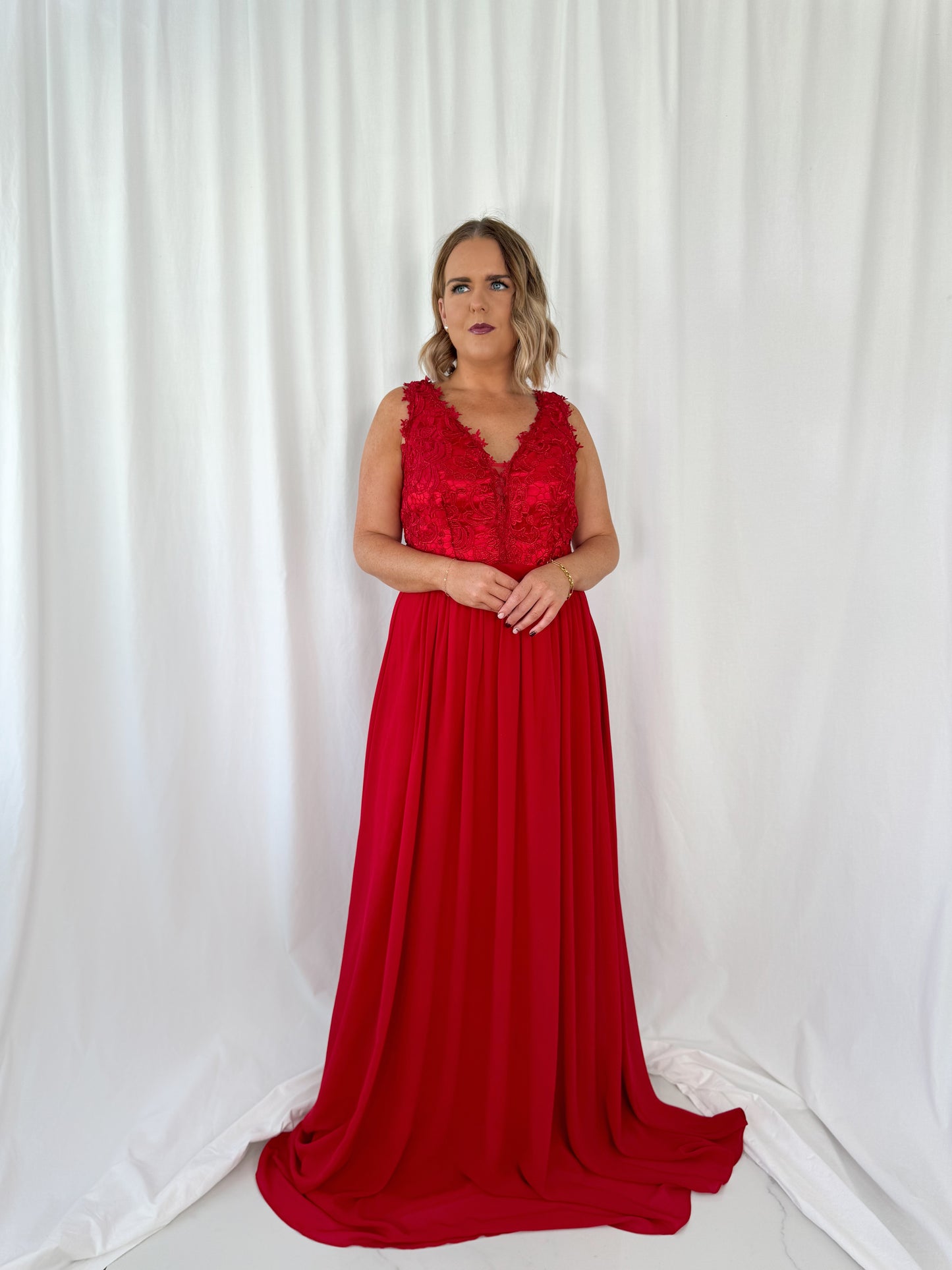 a woman in a red dress in a white dress