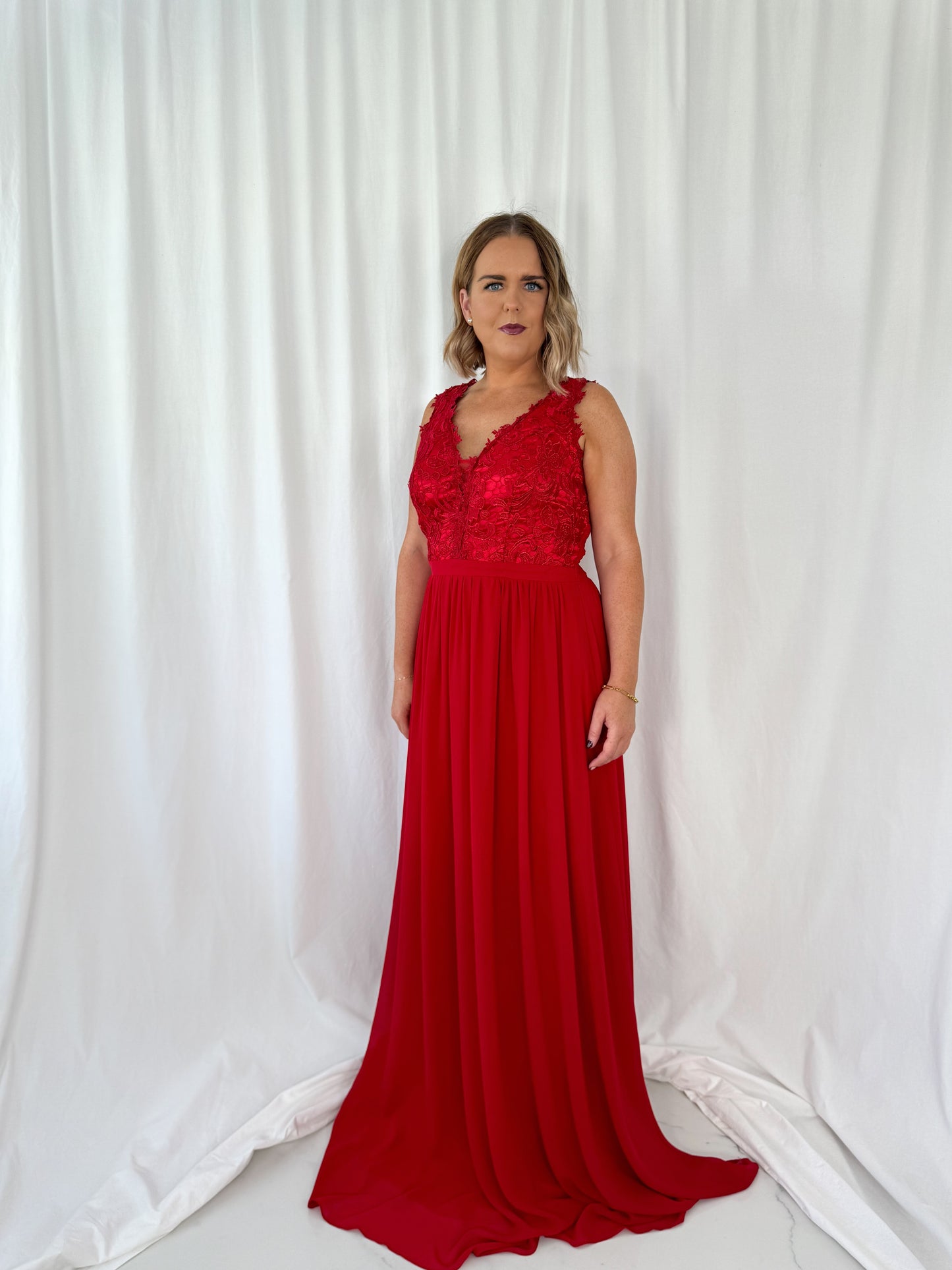 a woman in a red dress in a white dress