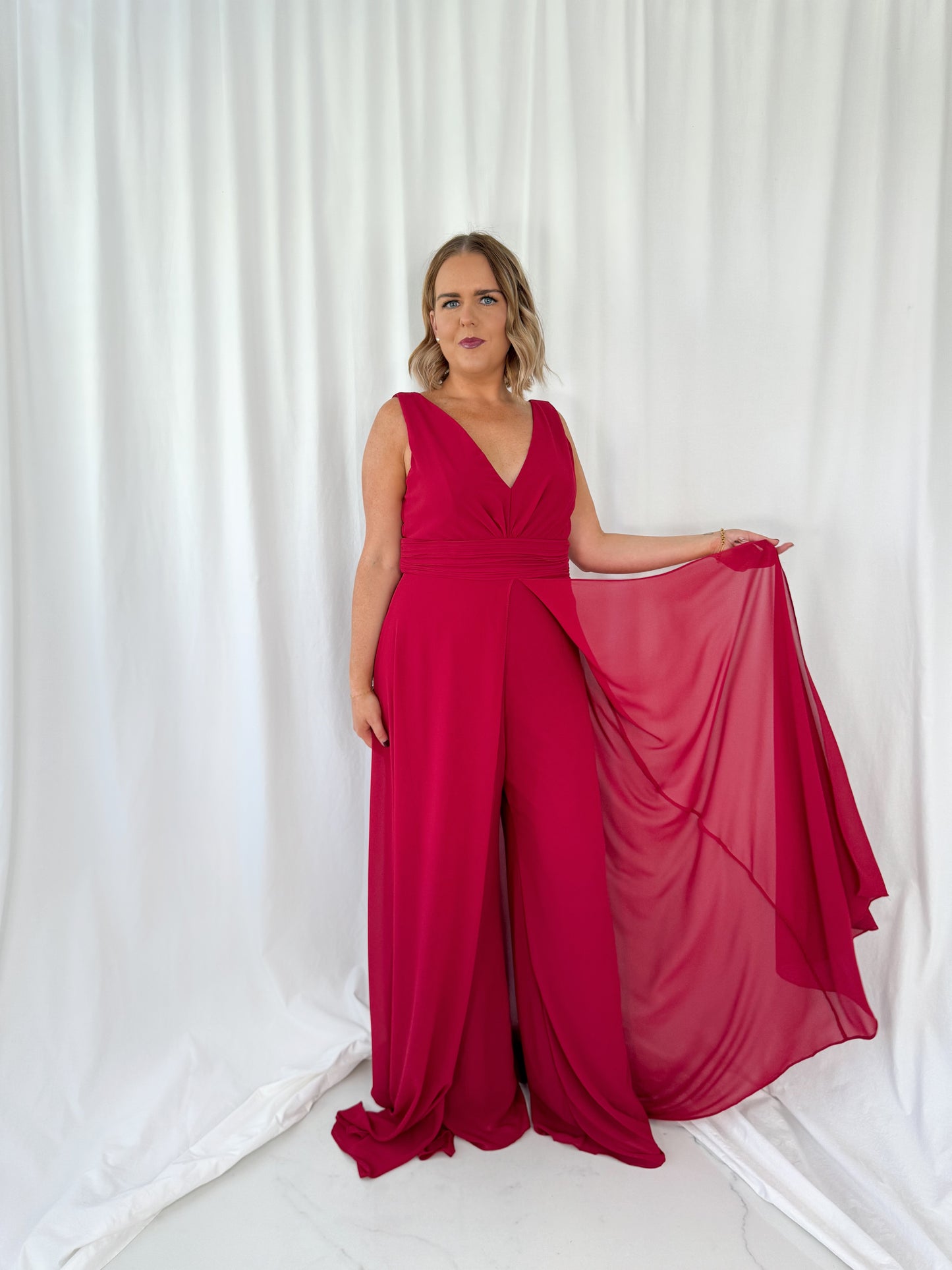 a woman in a red dress in a white dress