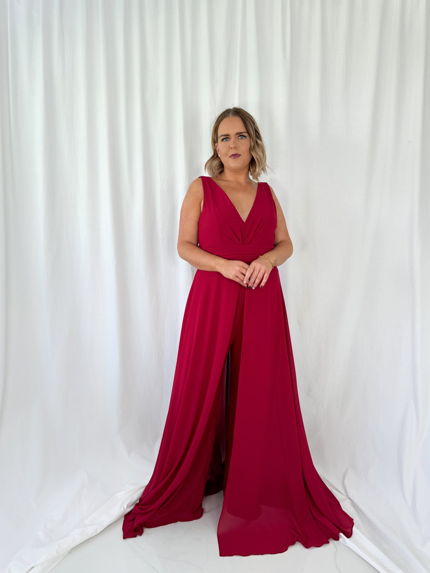 a woman in a red dress in a white dress