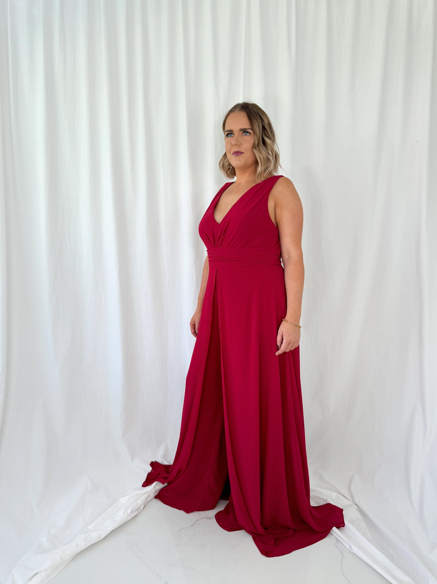 a woman in a red dress in a white dress