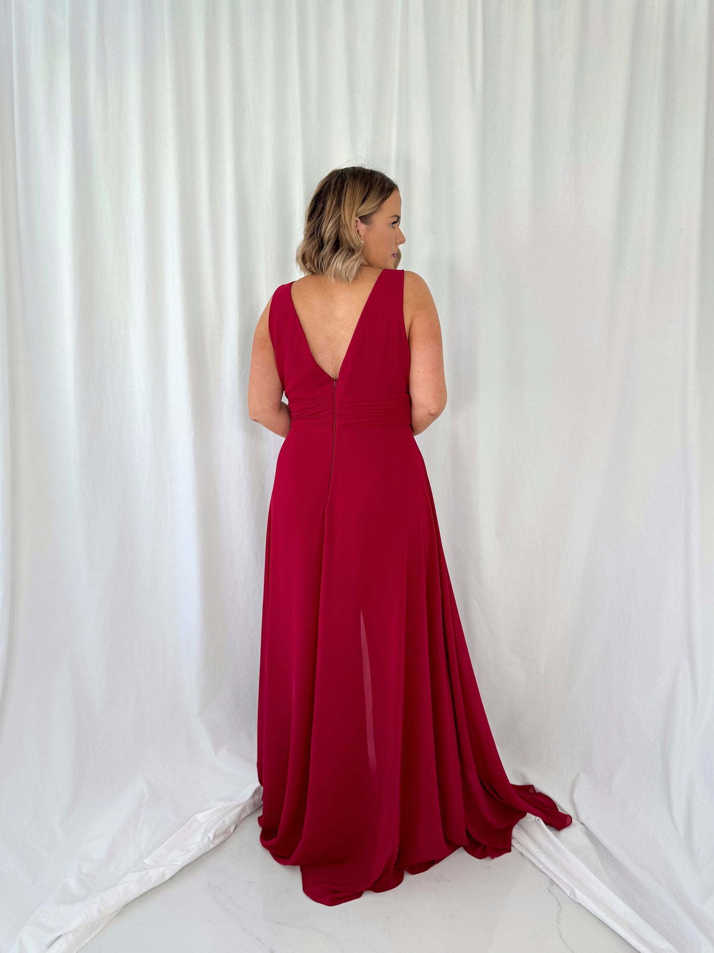 a woman in a red dress in a white dress