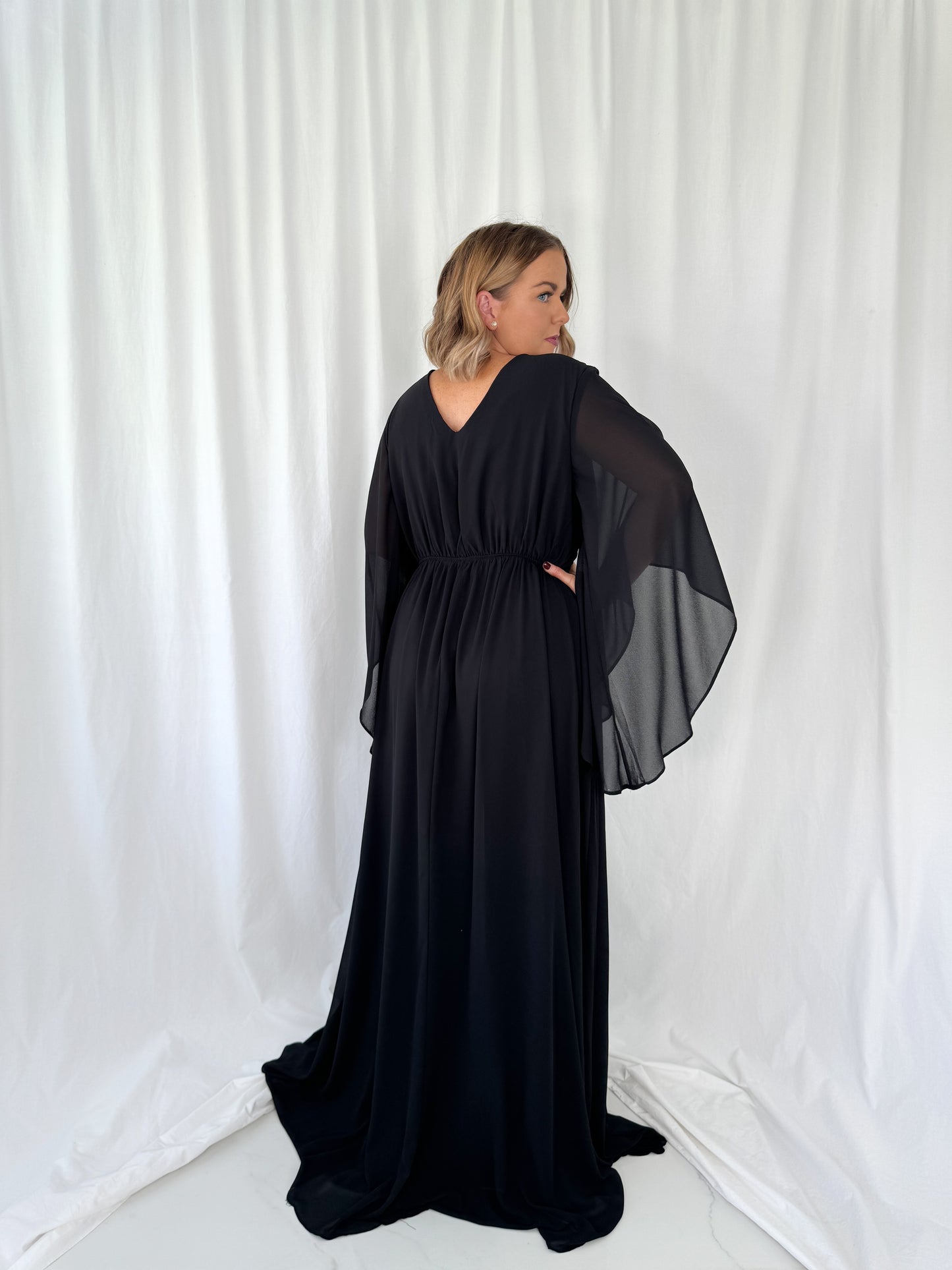 a man in a suit and tie holding a purse