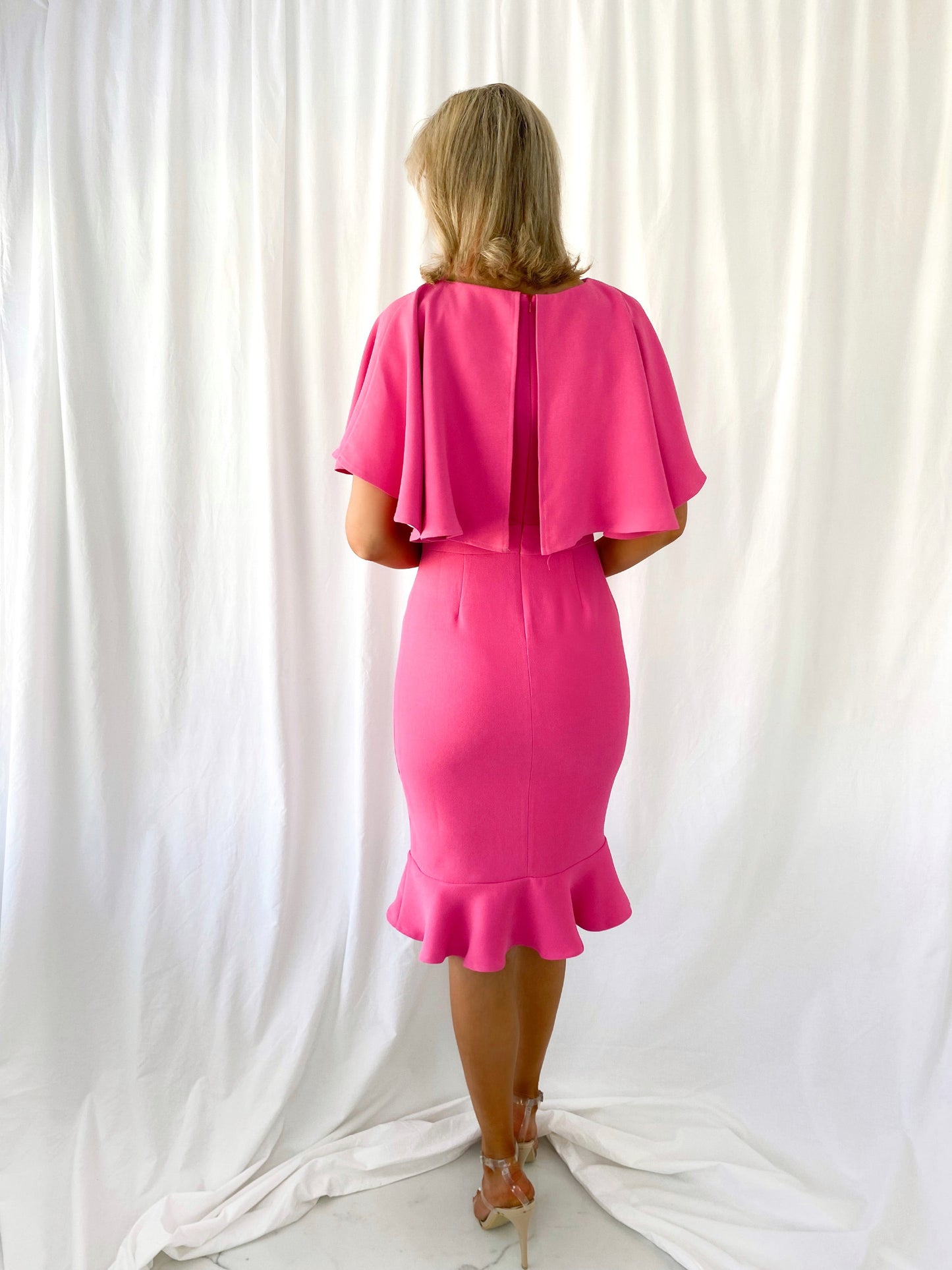 a woman in a pink dress in a pink dress