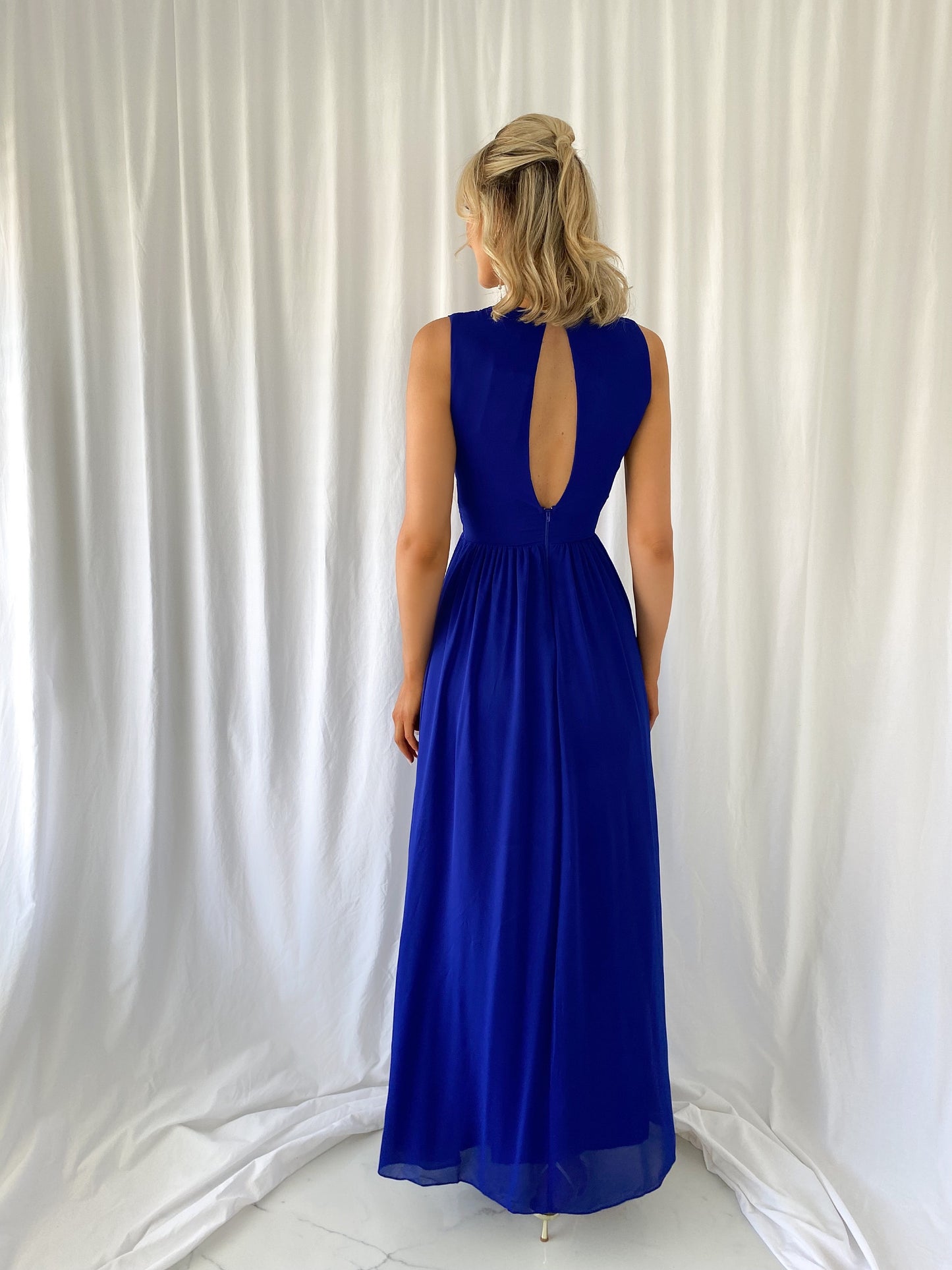 a woman in a blue dress and a blue dress