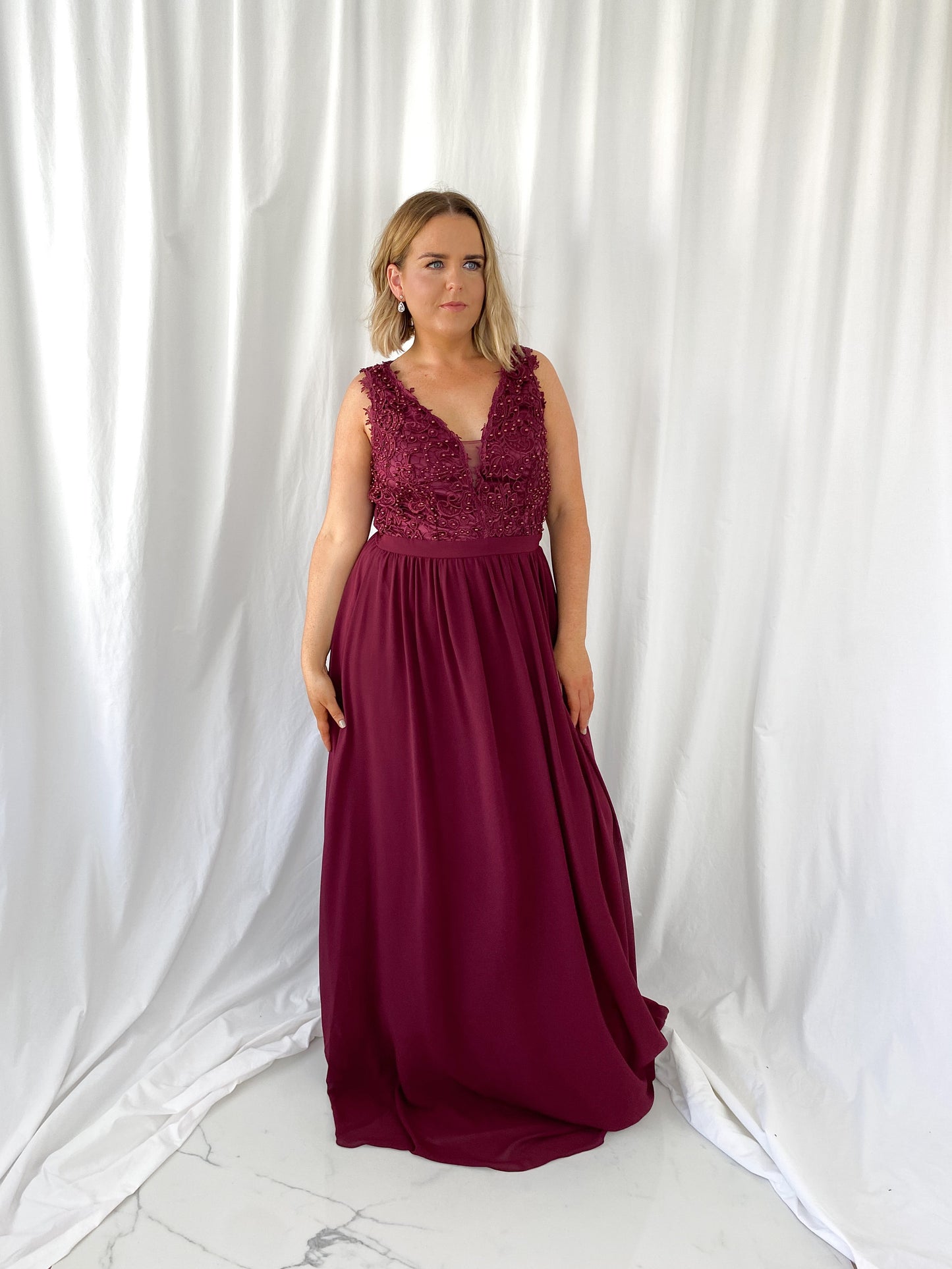 a woman in a red dress in a white dress