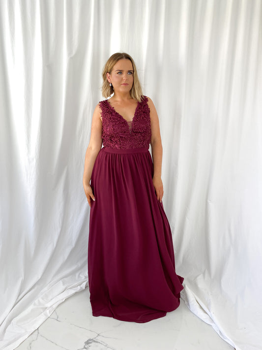 a woman in a red dress in a white dress