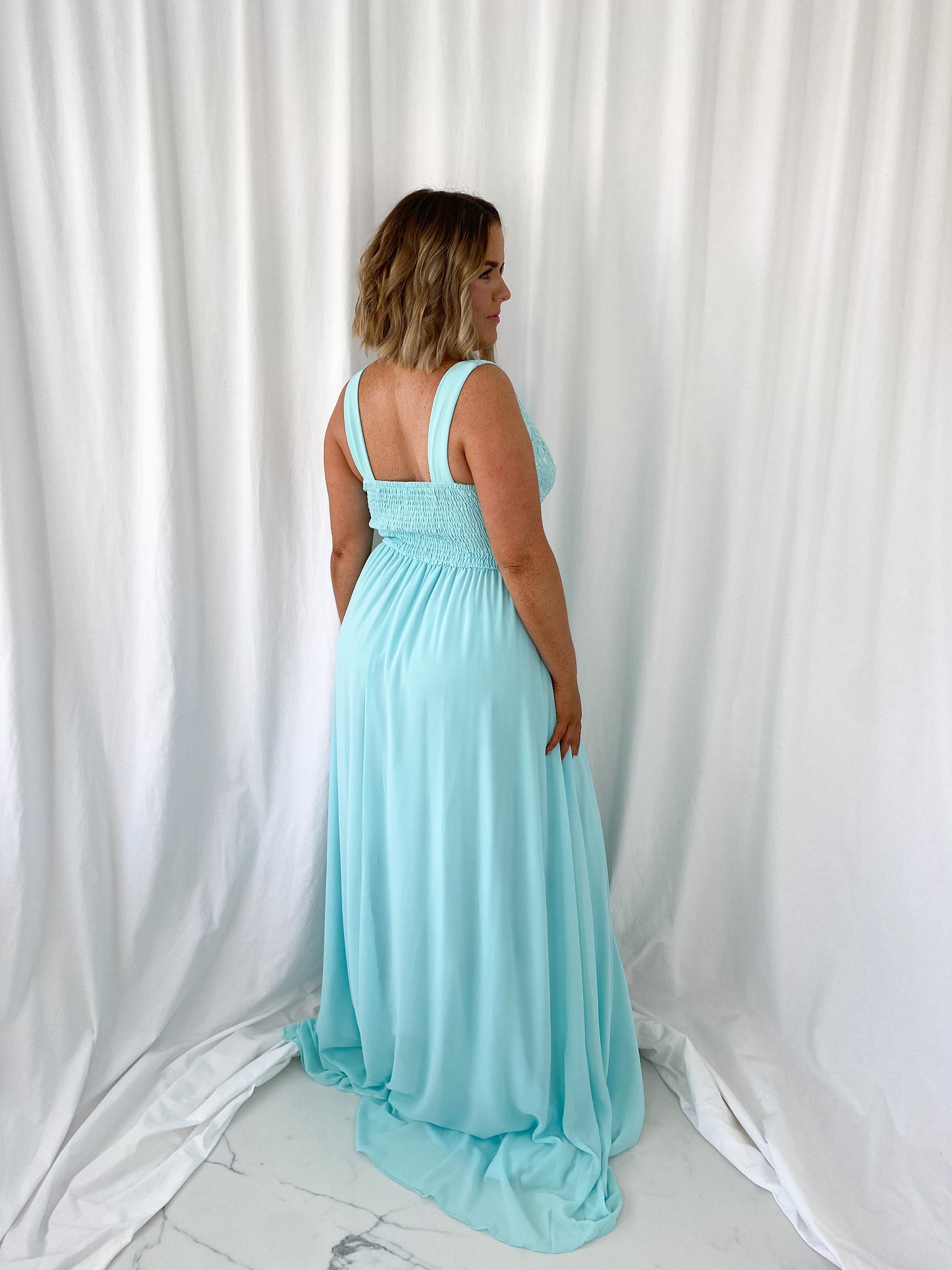 a woman in a white dress in a white dress