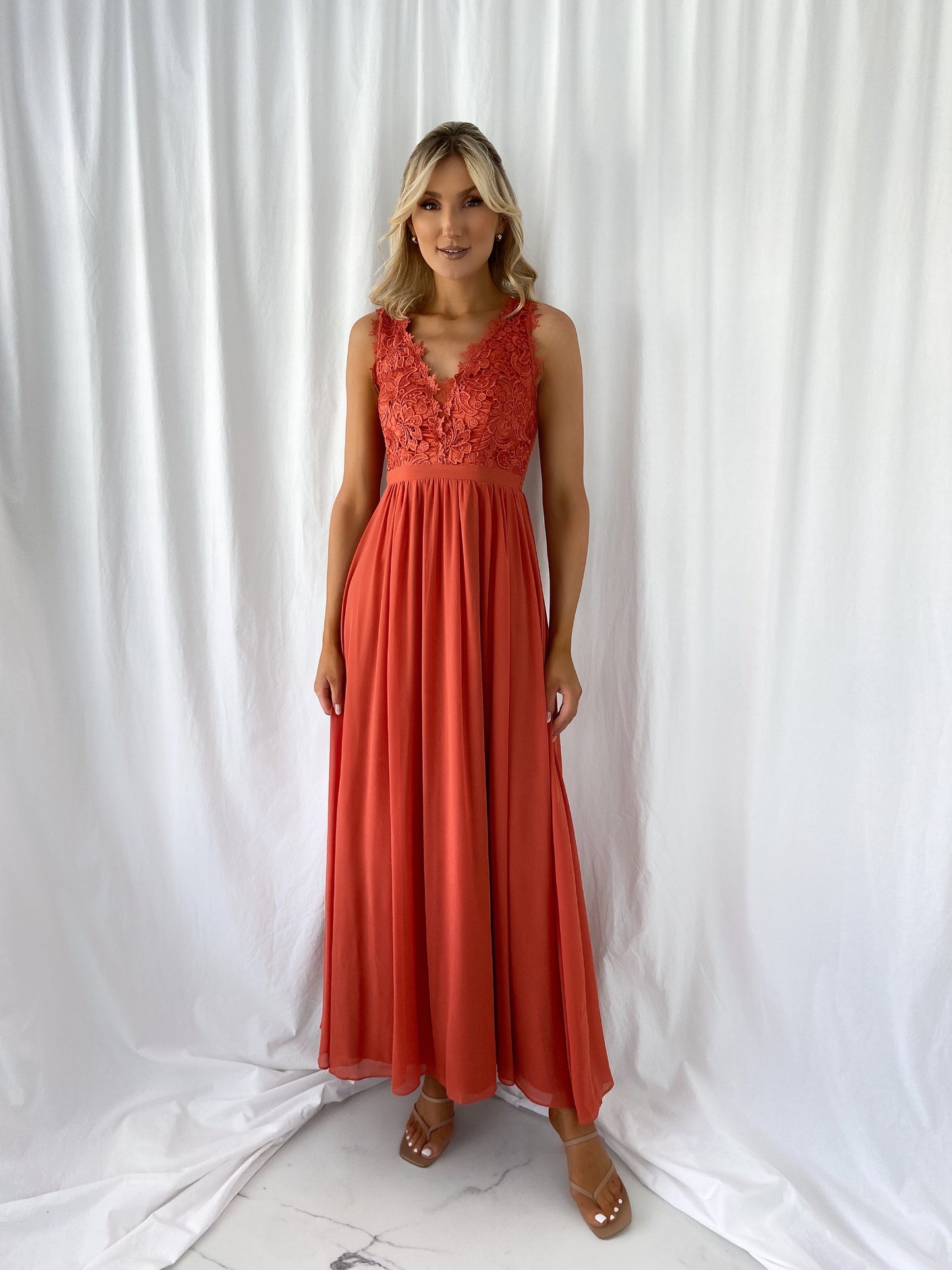 a woman in a red dress in a white dress