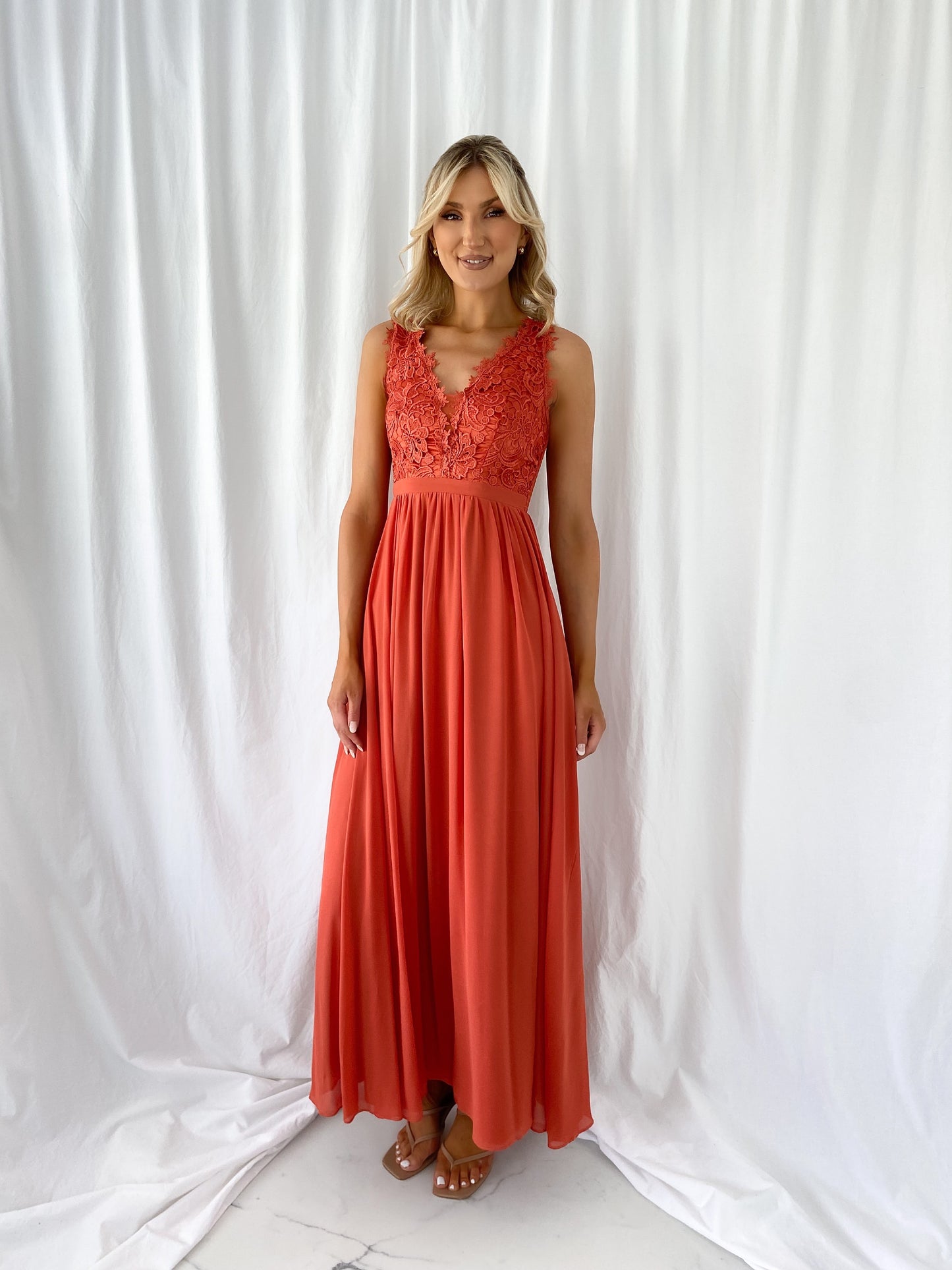 a woman in a red dress in a white dress