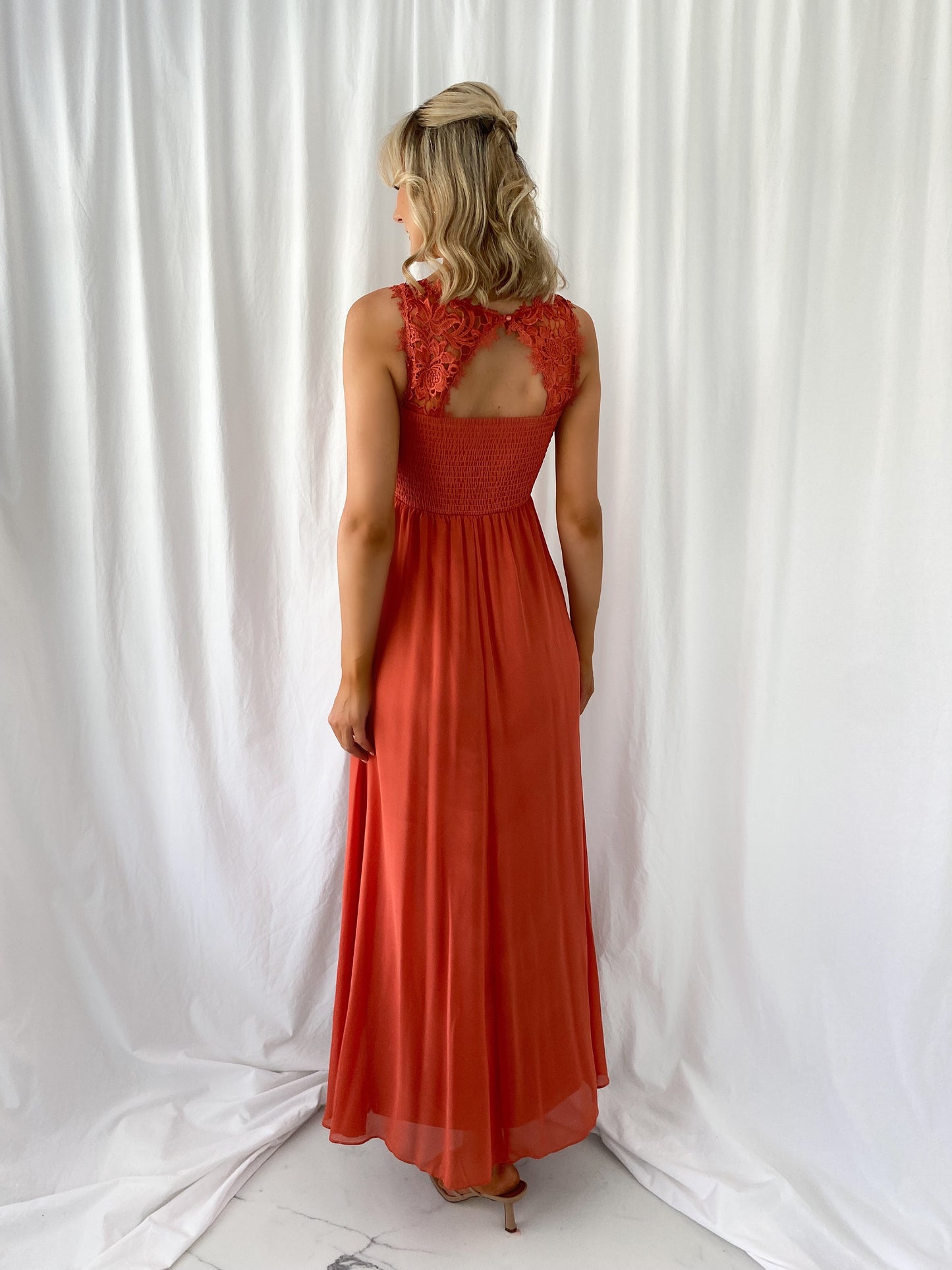 a woman in a red dress in a white dress