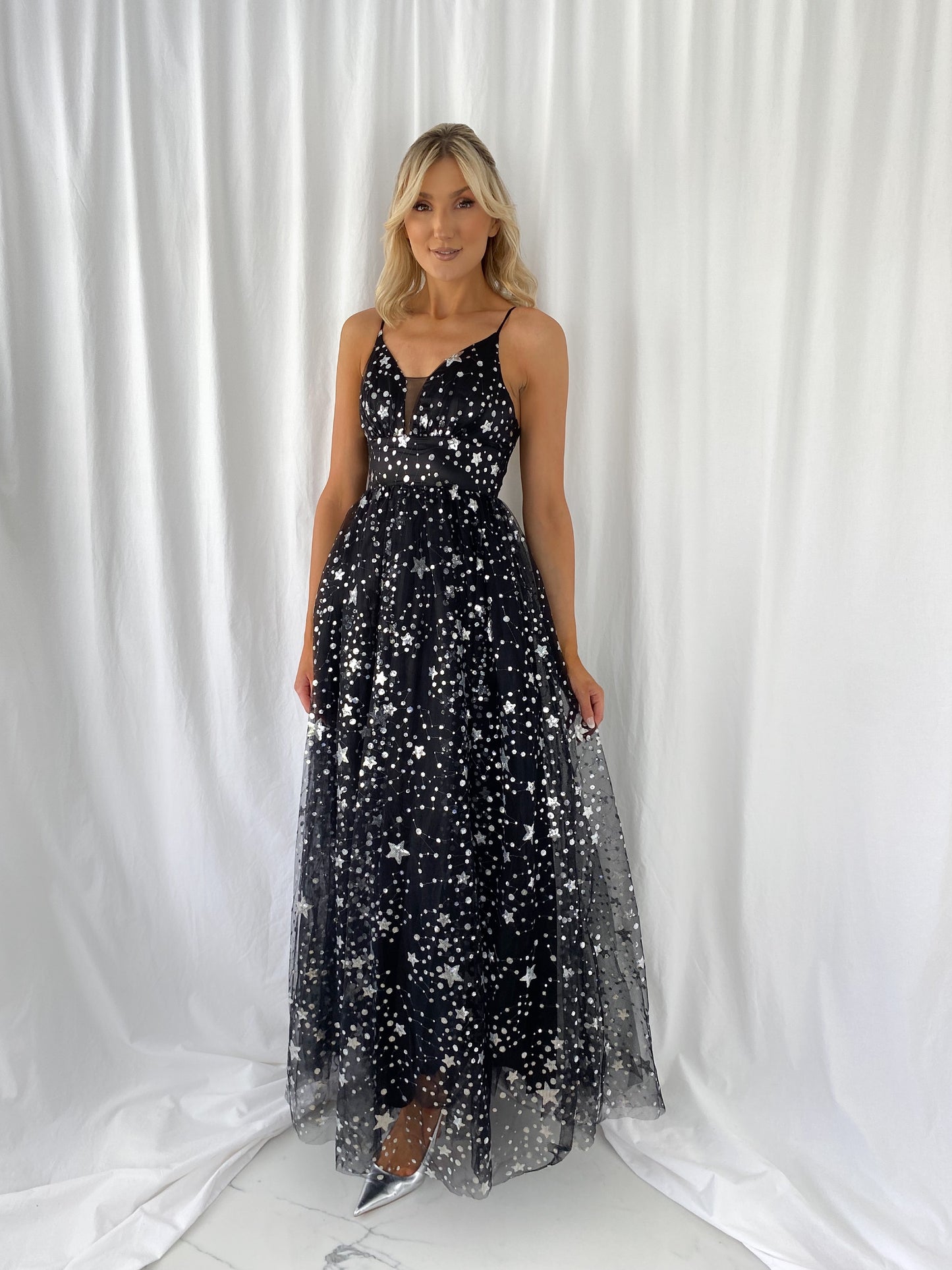a woman in a black dress and a black dress