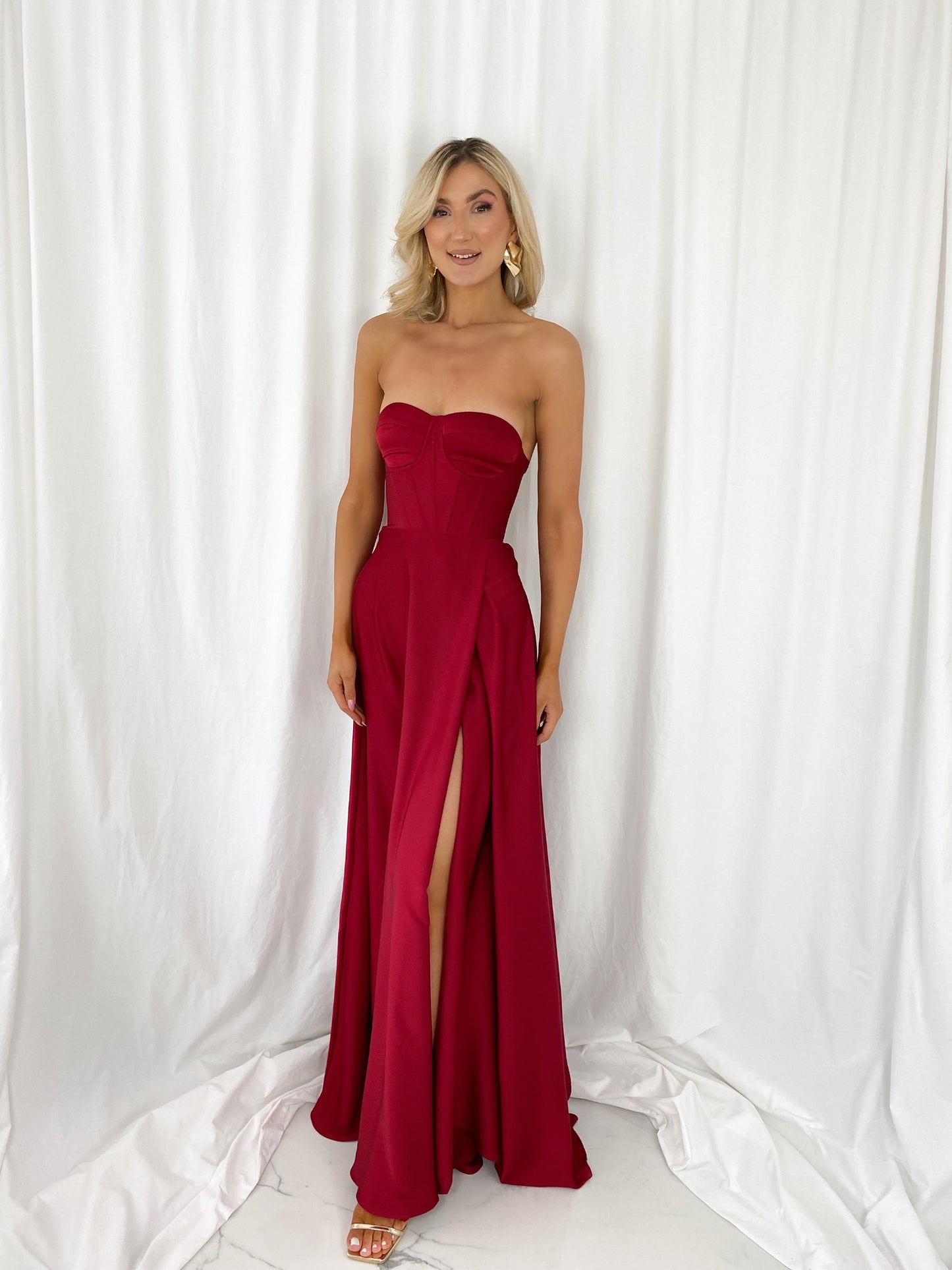 a woman in a red dress in a white dress