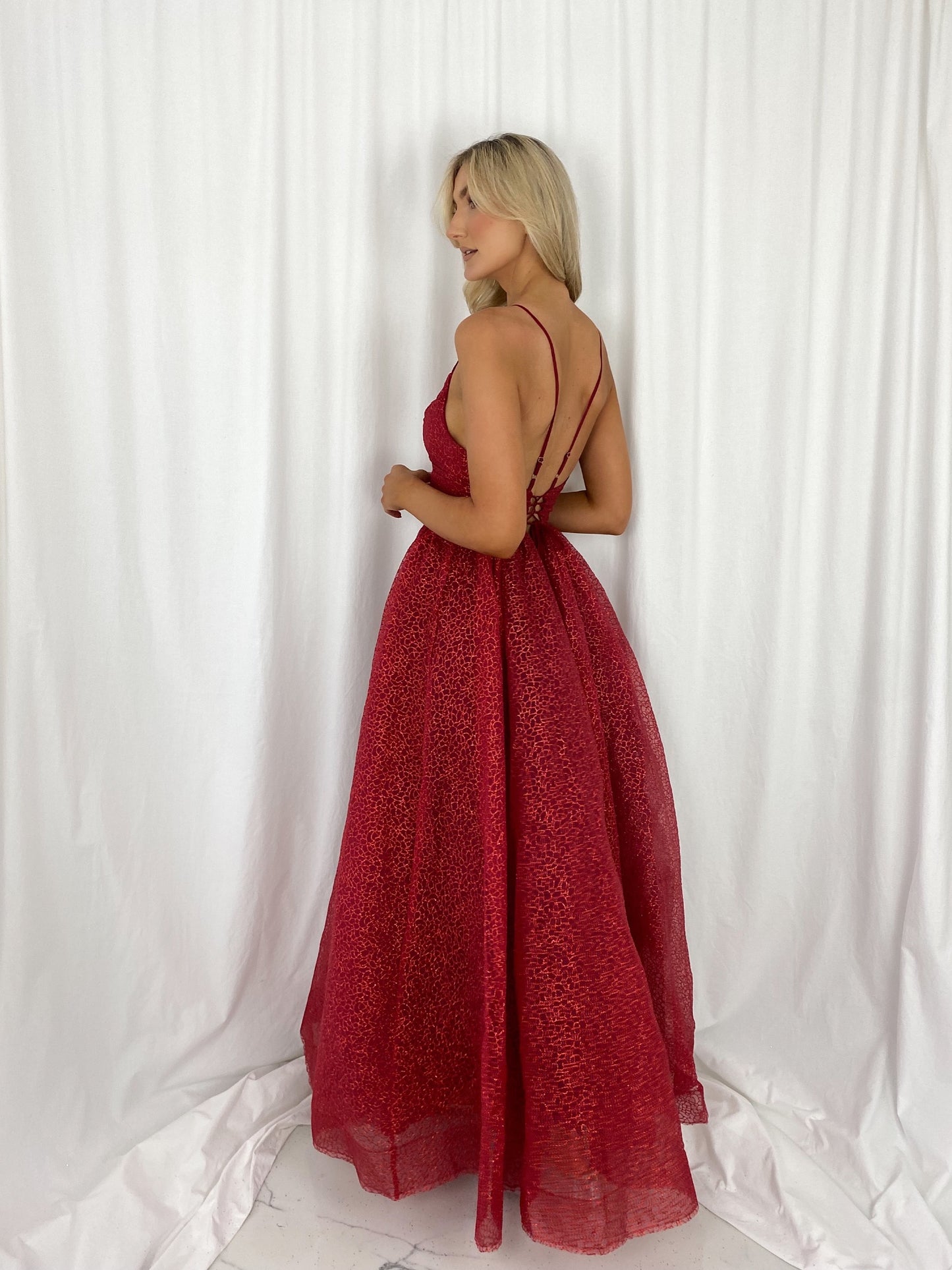 a woman in a red dress in a white dress