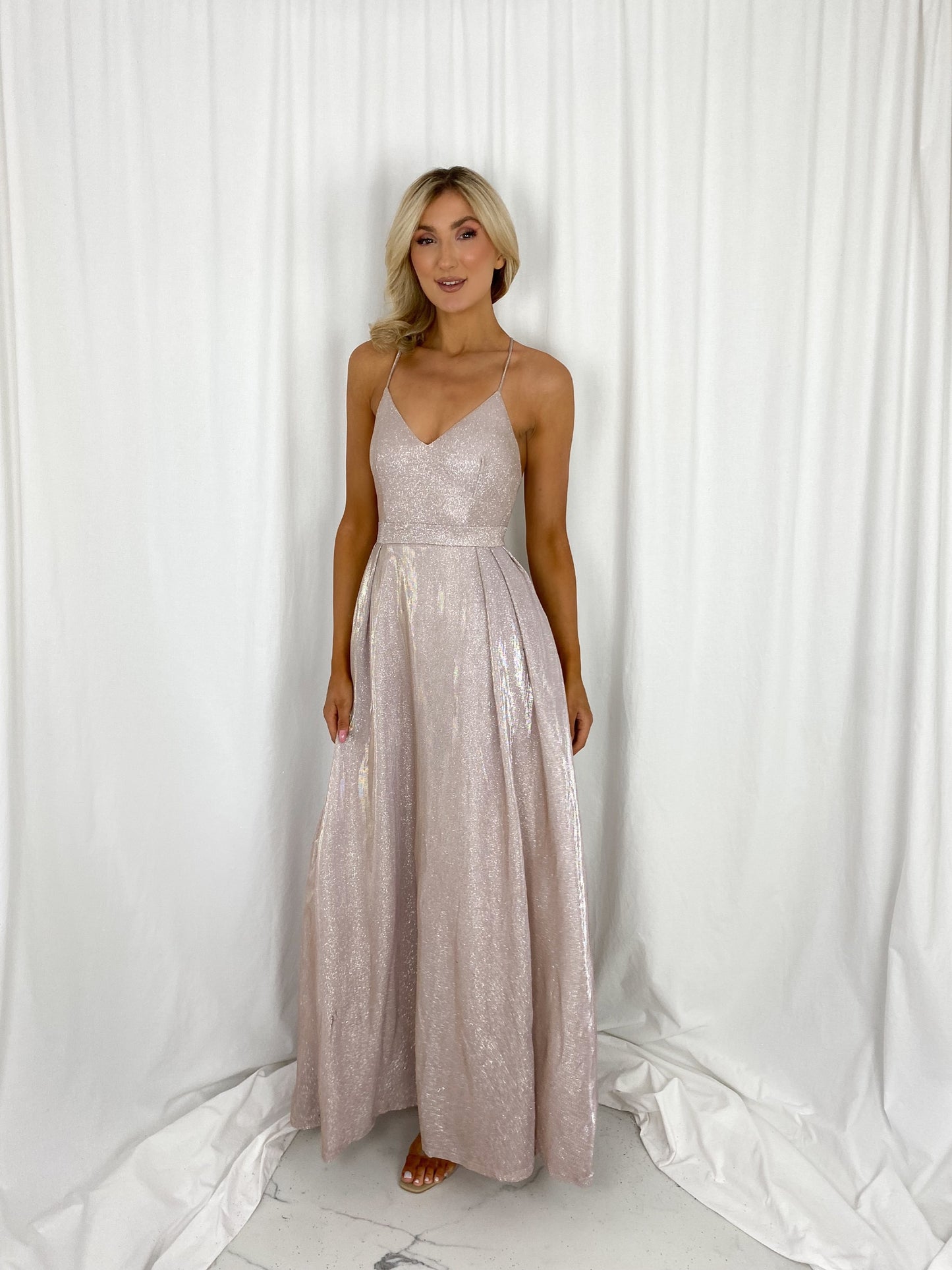 a woman in a white dress standing in a white dress