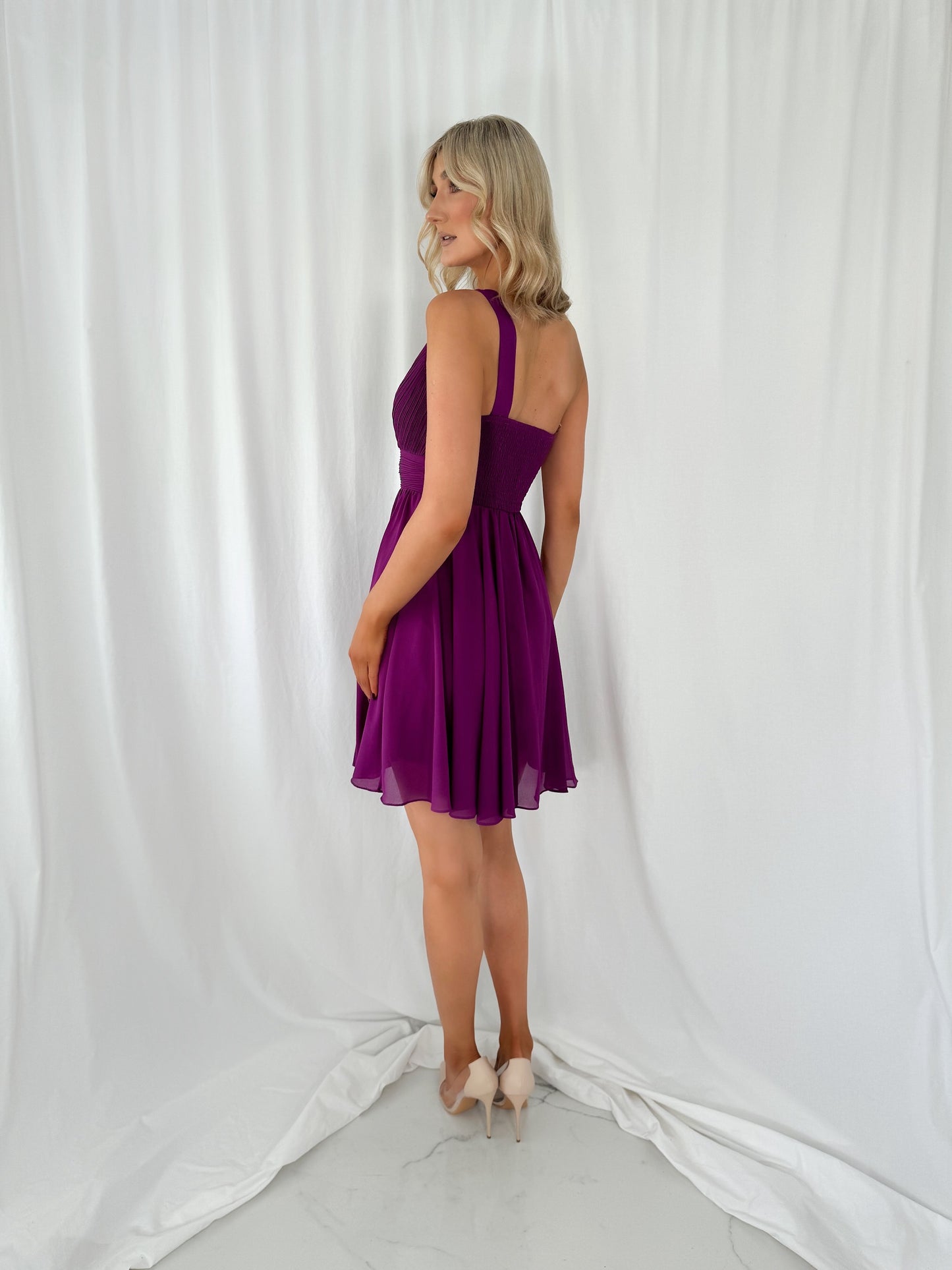 a woman standing on a snow covered ski slope