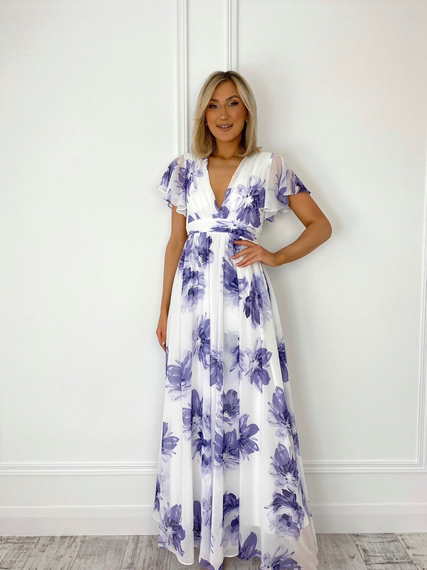 a woman in a dress holding a cell phone