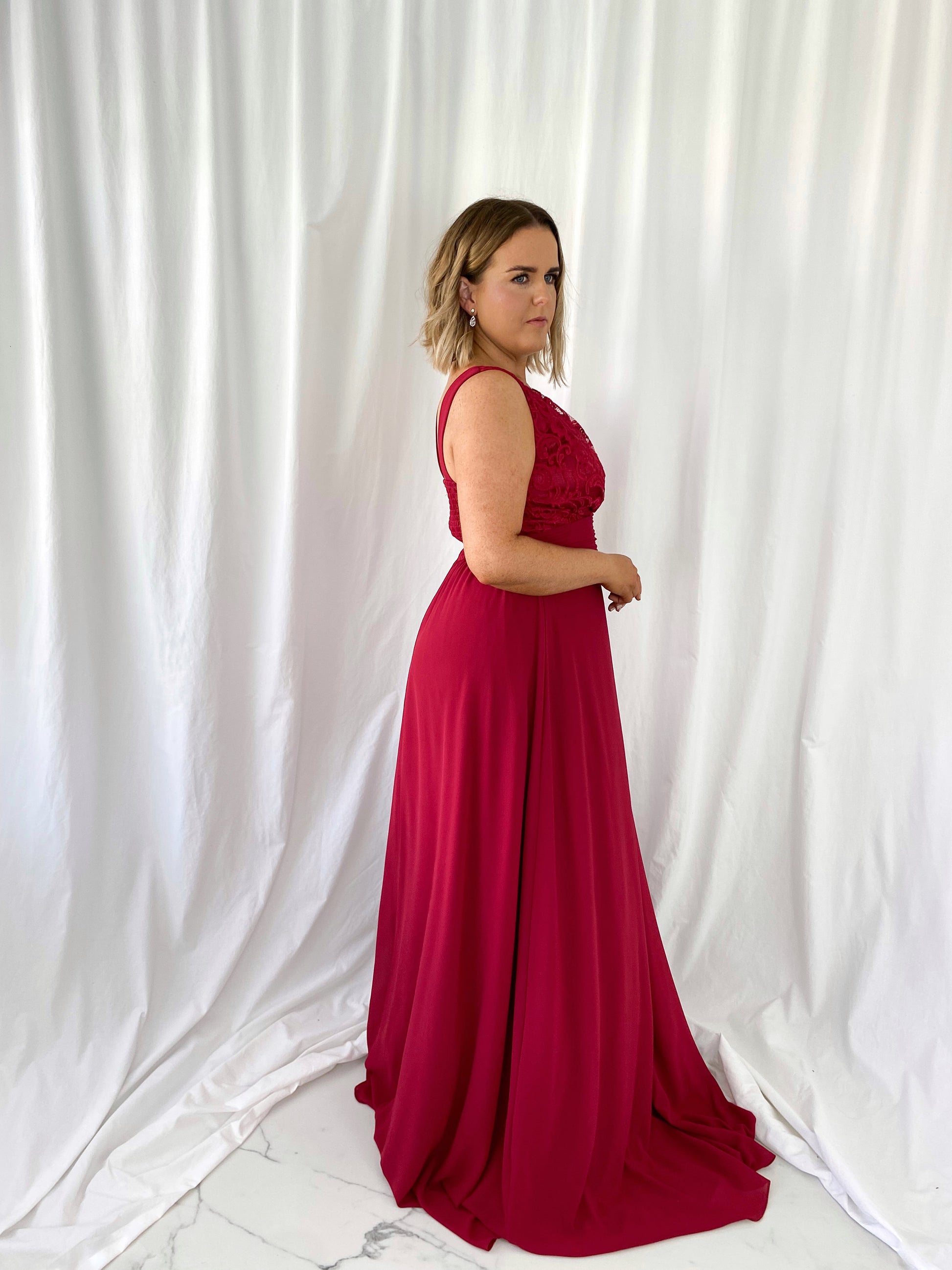 a woman in a red dress in a white dress 